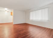 Thumbnail 44 of 48 - Living room with wood style floors throughout the kitchen