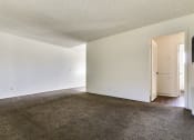 Thumbnail 28 of 48 - Living room with carpeted flooring