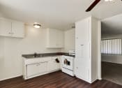 Thumbnail 30 of 48 - Kitchen with wood inspired floors throughout the dining area