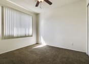 Thumbnail 31 of 48 - Bedroom With ceiling fan and carpeted flooring