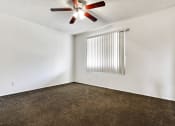 Thumbnail 32 of 48 - Bedroom with ceiling fan, carpeted flooring, vertical window coverings
