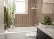 Thumbnail 18 of 25 - a bathroom with a toilet and a bath tub