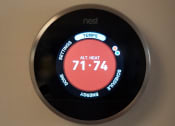Thumbnail 24 of 25 - a digital thermostat on a wall