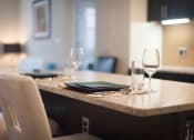Thumbnail 25 of 25 - a table with a tablet and wine glasses on it