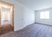 Thumbnail 33 of 35 - Bedroom with window and hallway at Bradford Run in Kokomo, IN