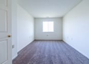 Thumbnail 34 of 35 - Bedroom with window and carpet at Bradford Run in Kokomo, IN