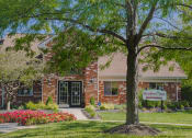 Thumbnail 9 of 35 - mature tree and landscaping outside leasing center at Bradford Run in Kokomo, IN