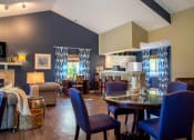 Thumbnail 10 of 35 - Clubhouse amenity with blue chairs at Bradford Run in Kokomo, IN