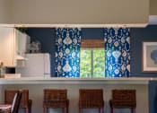 Thumbnail 11 of 35 - counter top in kitchen with blue curtains at Bradford Run in Kokomo, IN