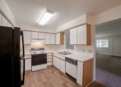 Thumbnail 4 of 35 - Kitchen with white cabinets at Bradford Run in Kokomo, IN