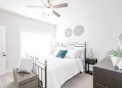 Thumbnail 6 of 12 - Bedroom with ceiling fan at McHenry Square Apartments, Augusta, Georgia