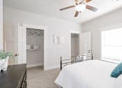 Thumbnail 5 of 12 - Bedroom with open closet at McHenry Square Apartments, Augusta