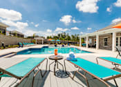 Thumbnail 10 of 12 - Lounge chairs by the pool at McHenry Square Apartments, Augusta, GA