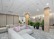 Thumbnail 5 of 21 - a large room with couches and potted plants at 3333 Wisconsin, Washington, DC