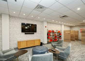 Thumbnail 8 of 21 - a room with chairs and a tv on the wall at 3333 Wisconsin, Washington, Washington