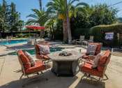 Thumbnail 16 of 30 - Poolside Dining Tables at Dartmouth Tower at Shaw, California
