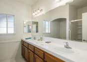 Thumbnail 27 of 30 - Bathroom with Vanity Lights at Dartmouth Tower at Shaw, Clovis, CA