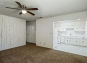 Thumbnail 15 of 16 - Kitchen With White Cabinetry And Appliances at Reef Apartments, California, 93704