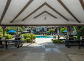 Thumbnail 14 of 30 - Shaded Outdoor Courtyard Area With Grill at Scottsmen Too Apartments, Clovis