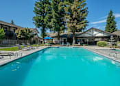 Thumbnail 9 of 30 - Outdoor Swimming Pool with Large Sundeck and Wi-Fi  at Scottsmen Too Apartments, Clovis, CA