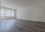Thumbnail 7 of 13 - Living area with 3 large windows and view