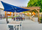 Thumbnail 9 of 36 - Poolside Sundeck And Grilling Area at Pacific Trails Luxury Apartment Homes, Covina, CA, 91722