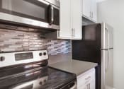 Thumbnail 26 of 36 - Efficient Appliances In Kitchen at Pacific Trails Luxury Apartment Homes, California, 91722 