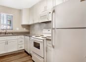 Thumbnail 28 of 36 - Appliances In Kitchen at Pacific Trails Luxury Apartment Homes, Covina, 91722