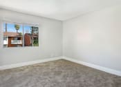 Thumbnail 33 of 36 - Carpeted Living Room at Pacific Trails Luxury Apartment Homes, California