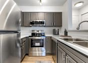 Thumbnail 19 of 30 - Modern Kitchen at The Apartments at Tamar Meadow, Columbia