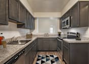 Thumbnail 3 of 35 - Kitchen with mosaic tiles at The Apartments at Owings Run, Maryland