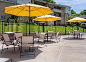 Thumbnail 3 of 27 - Shaded Chairs at The Apartments at Saddle Brooke, Cockeysville, Maryland