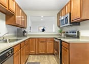 Thumbnail 27 of 44 - Fully Furnished Kitchen With Stainless Steel Appliances at The Apartments at Canterbury, Rosedale, MD, 21237