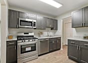 Thumbnail 10 of 39 - Kitchen With White Cabinetry And Appliances at Annapolis Roads, Annapolis, MD