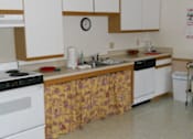Thumbnail 4 of 5 - Community Room Kitchen