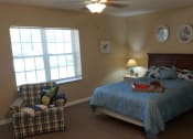 Thumbnail 3 of 36 - Bedroom With Expansive Windows at Savannah Court of Camilla, Georgia