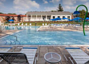 Thumbnail 4 of 15 - Pool Area with Lounge Chairs at Gateways at Randolph, Randolph, New Jersey