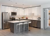 Thumbnail 7 of 32 - Fitted Kitchen With Island Dining at 735 Truman, Hyde Park, MA, 02136