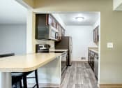 Thumbnail 15 of 18 - dining room brown cabinets stainless steel