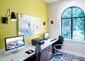 Thumbnail 31 of 48 - Modern home office with dual workstations and accent wall at Nalle Woods of Westlake Apartments, Austin, 78746