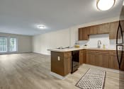 Thumbnail 6 of 16 - Kitchen and Living Room