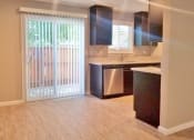 Thumbnail 3 of 33 - View of dining and kitchen area and sliding glass door leading to private patio