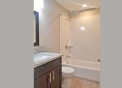 Thumbnail 5 of 33 - Bathroom view with vanity, toilet, and tub shower combo