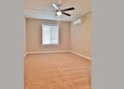 Thumbnail 15 of 33 - View of bedroom with well it window, ceiling fan, and AC
