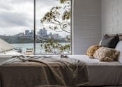 Thumbnail 6 of 9 - a bedroom with a bed and a window with a view of the city
