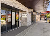 Thumbnail 2 of 15 - The image shows the exterior of a Uko leasing office with a modern design.
