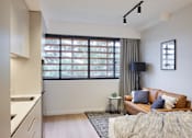 Thumbnail 6 of 11 - a living room with a couch and a window