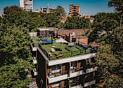 Thumbnail 1 of 9 - an aerial view of a building with a green roof