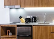 Thumbnail 7 of 11 - a kitchen with wooden cabinets and a sink