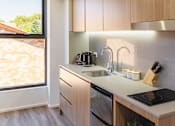 Thumbnail 4 of 11 - a kitchen with a sink and a window